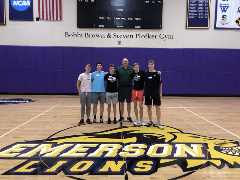 Tour athletes with a coach at Emerson College's Bobbi Brown and Steven Plofker Gym.