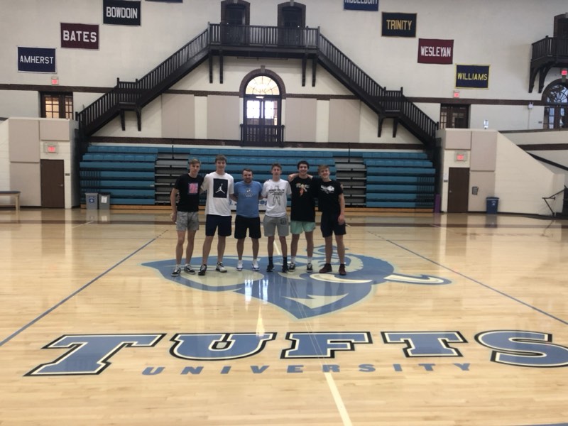 Tour athletes at centre court at Tufts University.