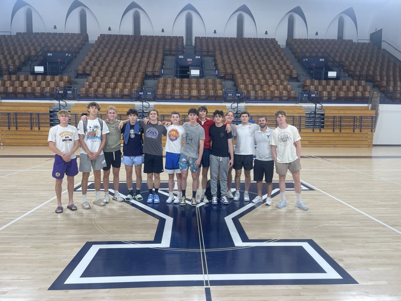 The tour group at centre court at Yale.