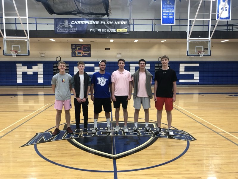 Tour athletes at centre court at Yeshiva University.
